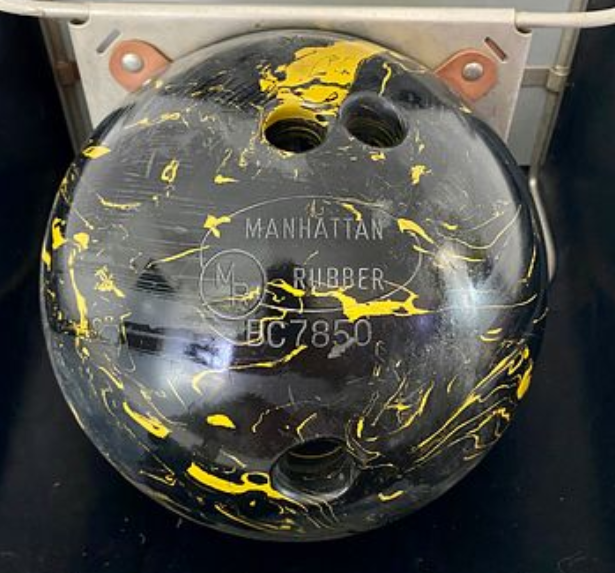Manhattan Rubber black-and-yellow swirl reference image supplied for the collection